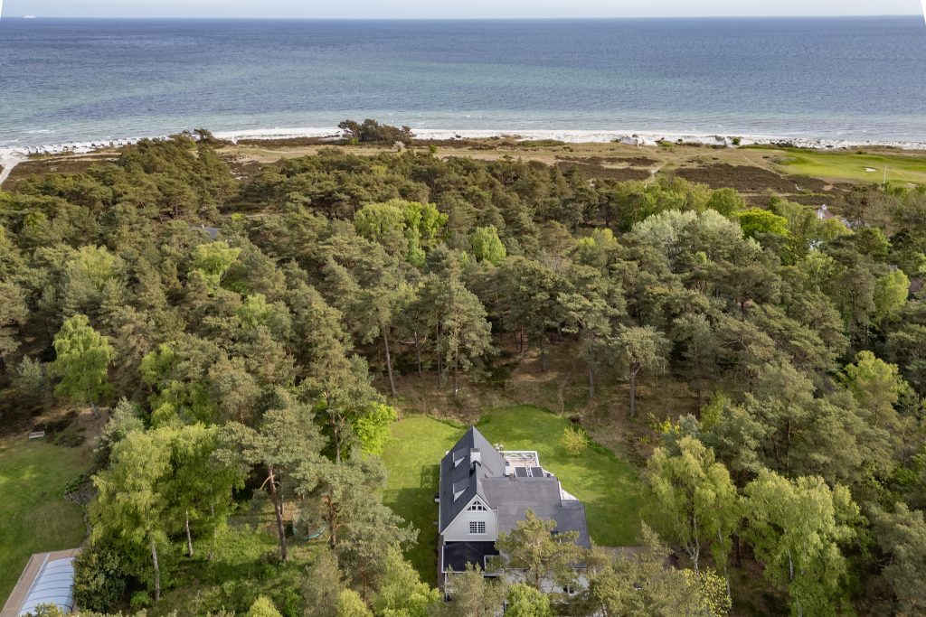 Aerial view of villa in Höllviken, South Sweden with forest surroundings and beach just 350 meters away